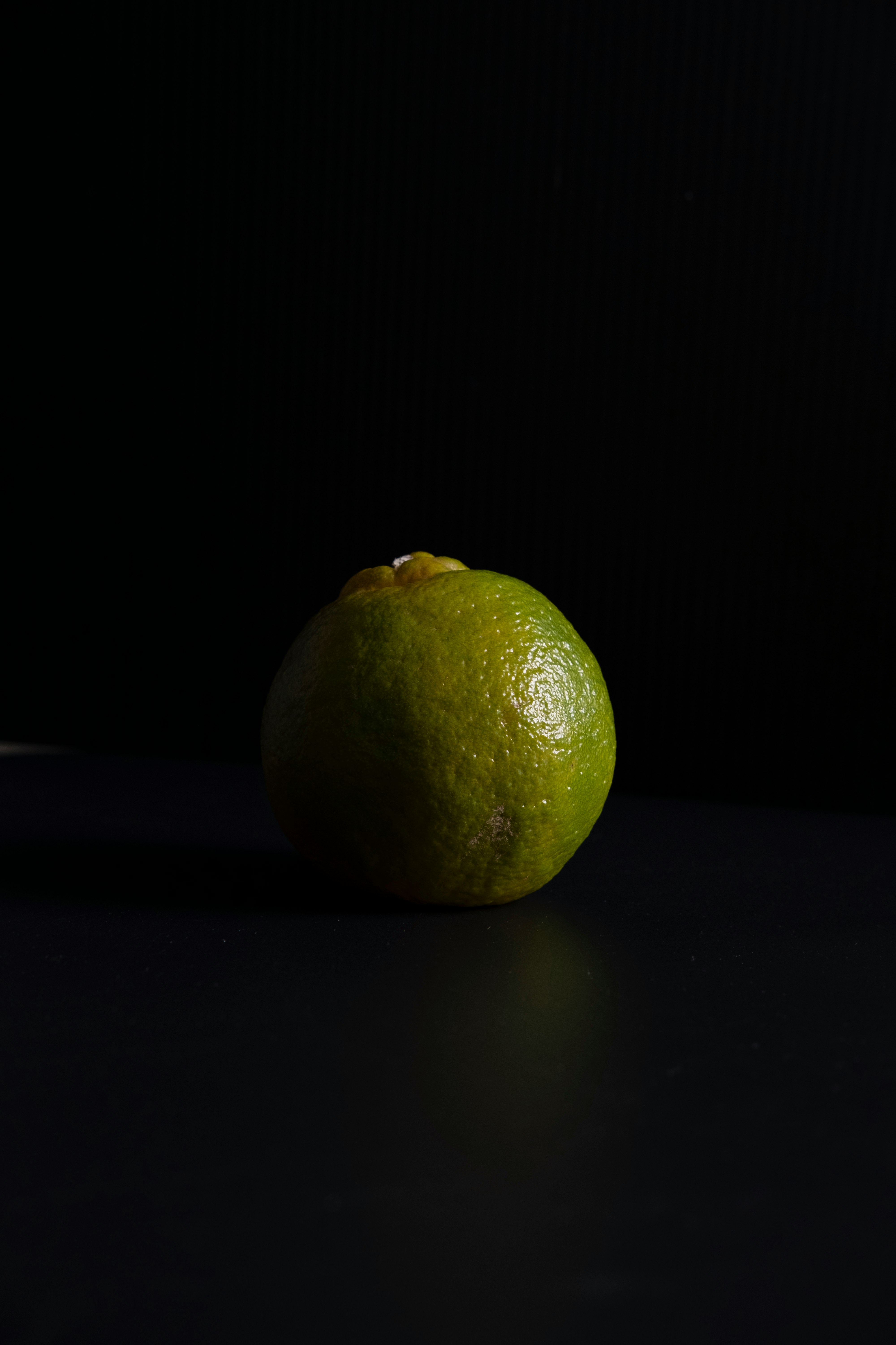 yellow lemon fruit on black surface